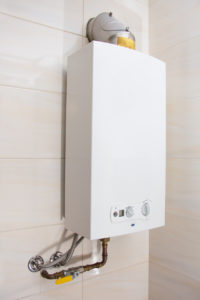 tankless water heater attached to wall of home